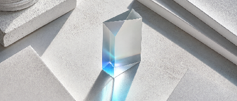 A conceptual editorial image showing a transparent glass ledger with flowing blue light representing data, resting on a stack of official documents, symbolizing