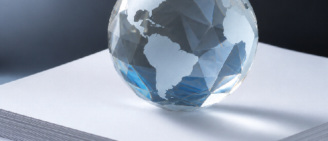 A stylized globe with a transparent digital overlay representing data streams and legal frameworks