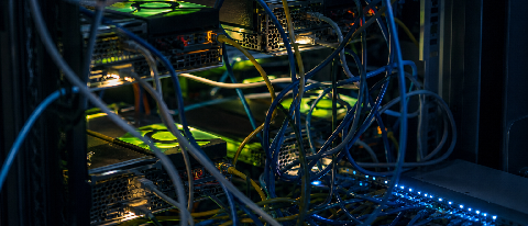 A server rack with glowing nodes connected by tangled, knotted Ethernet cables, symbolizing fragmented GPU allocation and communication bottlenecks in a shared 