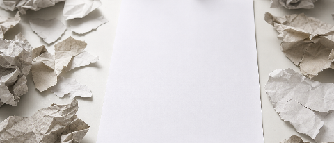 A clean, authoritative document resting on a pristine white surface, surrounded by scattered, blurred, and torn pieces of paper representing unreliable or corru
