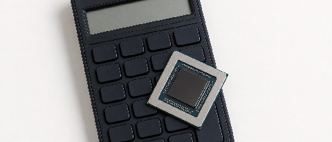 A financial calculator with a small microchip on top, symbolizing the cost calculation of AI hardware.