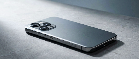 A sleek smartphone resting on a minimalist desk with subtle warm lighting, symbolizing powerful local AI computation.