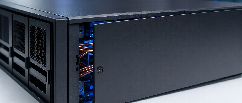 A sleek, modern server rack with one drawer slightly ajar revealing complex internal wiring, symbolizing a security breach