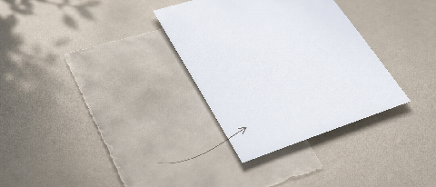 Two layered documents, one faded and one crisp, linked by a thin connector line, on a neutral studio backdrop.