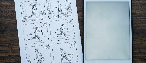 A detailed storyboard layout with character sketches and camera direction notes on a desk