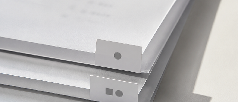 A stack of translucent document layers with blurred text, separated by clear vertical dividers representing metadata filters.