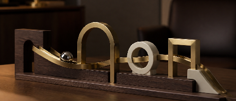 An elegant minimalist kinetic track sculpture representing a connected workflow.