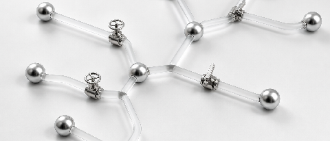 A minimalist physical model of a logic flow graph with spheres and tubes.