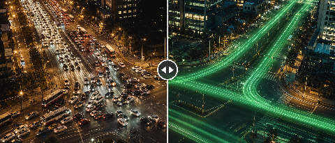 A stylized aerial view of a city intersection at dusk with glowing green light trails indicating smooth traffic flow