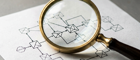 A conceptual editorial image showing a magnifying glass revealing intricate causal connections within a complex diagram.