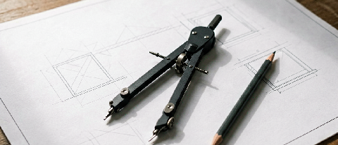 Editorial still life of precise drafting tools representing structured workflow