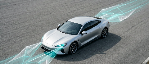 A sleek sports car on a test track surrounded by abstract digital data streams