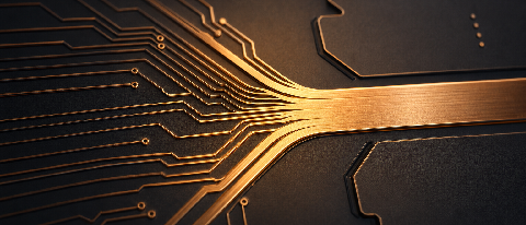Macro photograph of streamlined copper micro-pathways merging on a dark silicon chip.