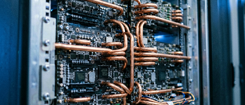 A high-tech editorial shot of a dense server rack with cooling pipes, symbolizing industrial-grade AI computing power