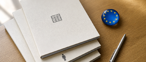 Three stacked compliance documents on a desk, with symbols representing data, risk, and human oversight.