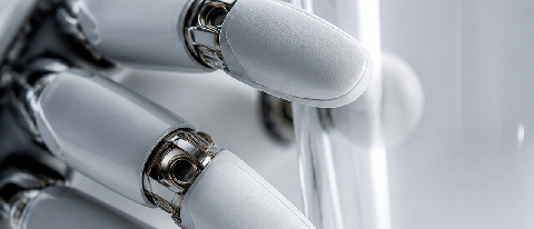 A close-up of a sophisticated robotic hand precisely gripping a transparent glass cup.
