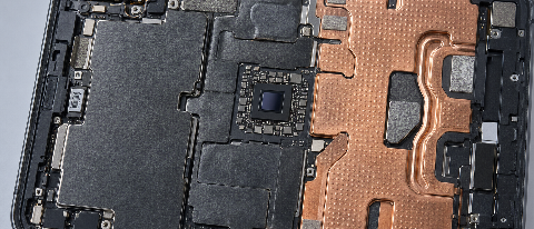 Close-up of a smartphone chassis with visible internal cooling components like vapor chambers and graphene layers