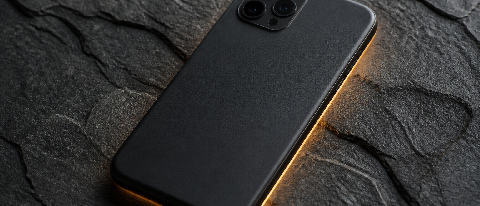 A smartphone resting on a dark surface with a subtle, contained light effect representing local processing