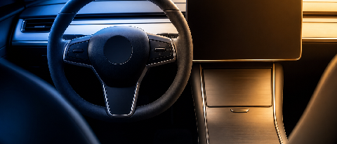 A conceptual split view of a car interior showing the transition of control between automated system and human driver