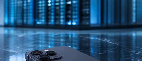 A minimalist composition showing a smartphone connected to a distant server tower, symbolizing cloud reliance.