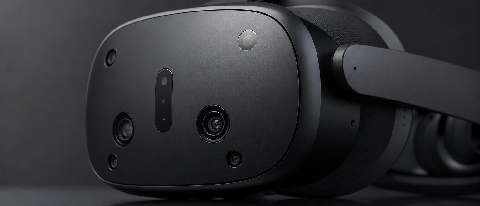 A close-up of a futuristic VR headset lens with a subtle, blurred reflection of an eye, set against a dark, moody background to represent high-tech latency issu
